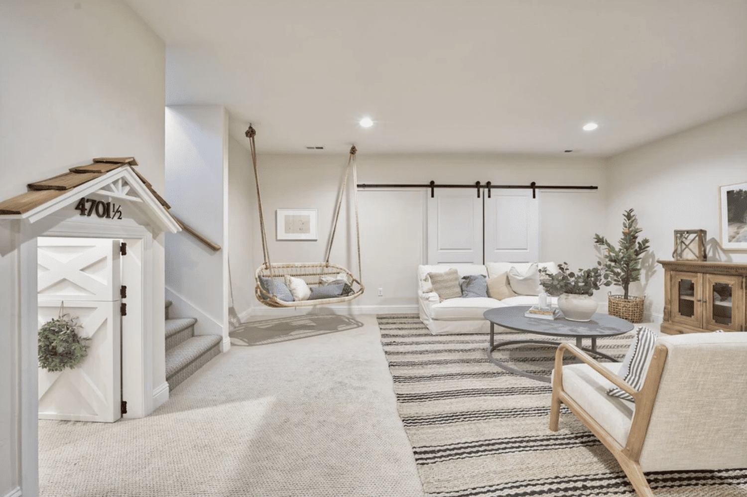 Finished basement renovation with new flooring, recessed lighting, and custom built-ins by Robin Construction in Novi, MI